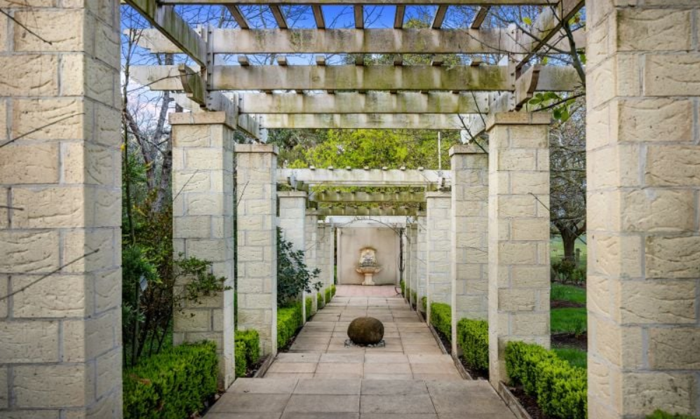 Stone pergola walkway in the Villa Capra gardens