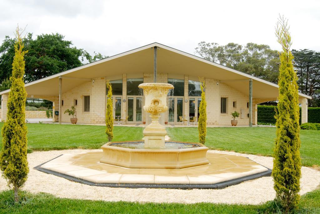 The gatehouse at Villa Capra beyond the formal fountain and lawns