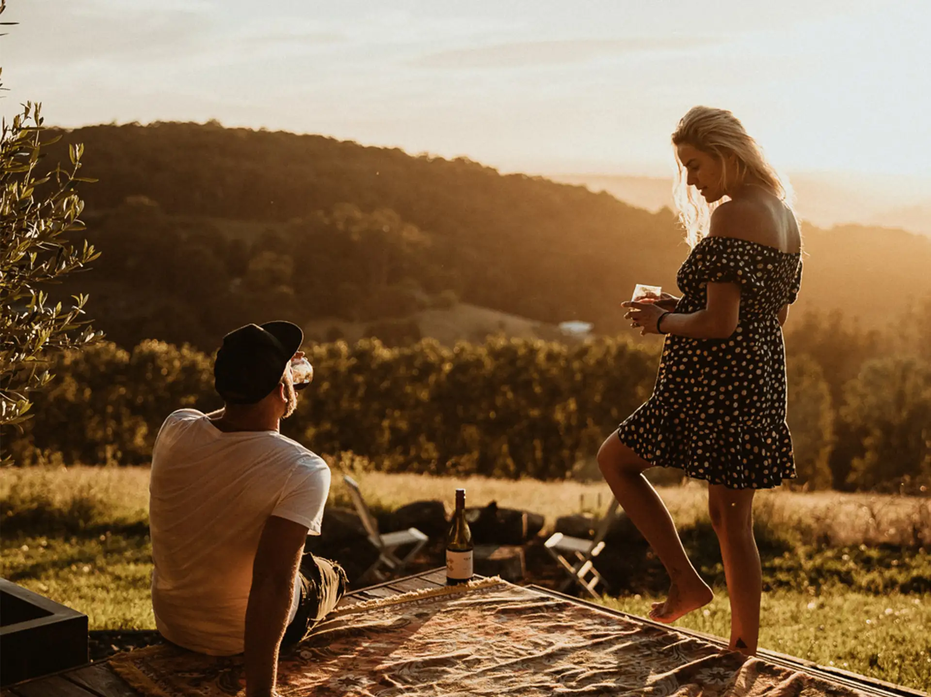 Guests enjoying a Yarra Valley sunset with a glass of wine