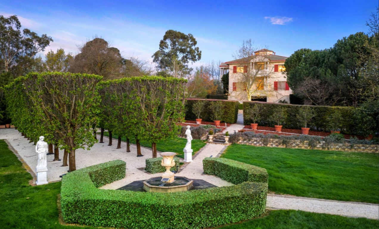 Formal gardens, fountain and lawns beneath the Villa Capra gatehouse