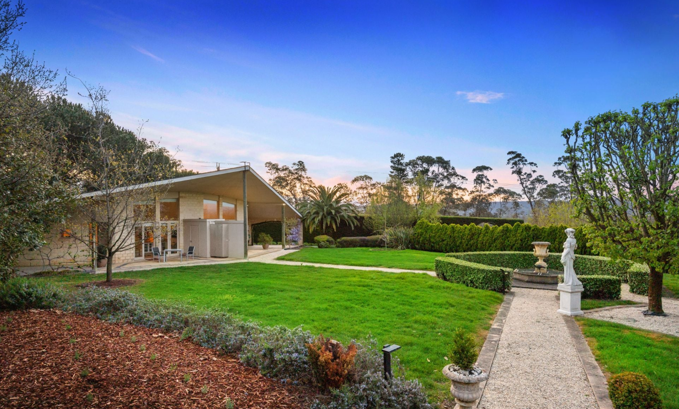 Formal lawns, statuary and garden paths beside the Villa Capra gatehouse