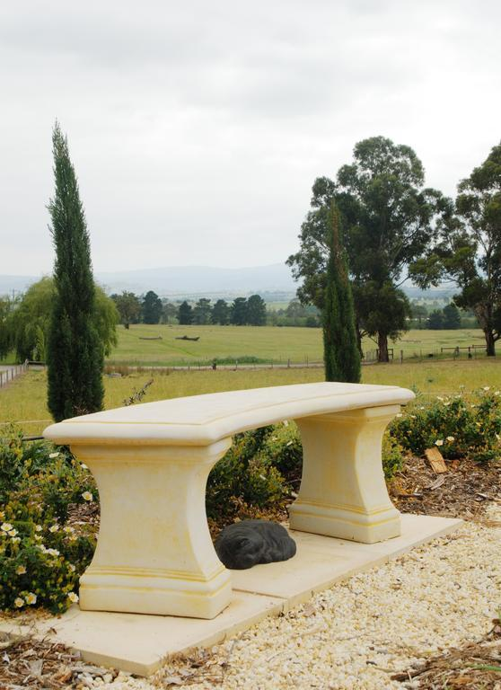 Stone garden seat with Yarra Valley views