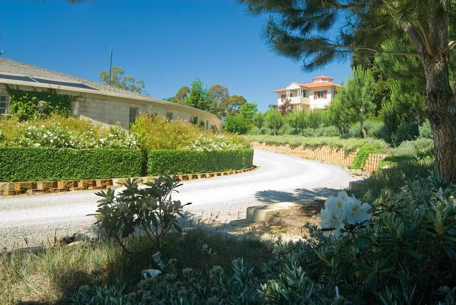 Landscaped driveway winding through the Villa Capra grounds